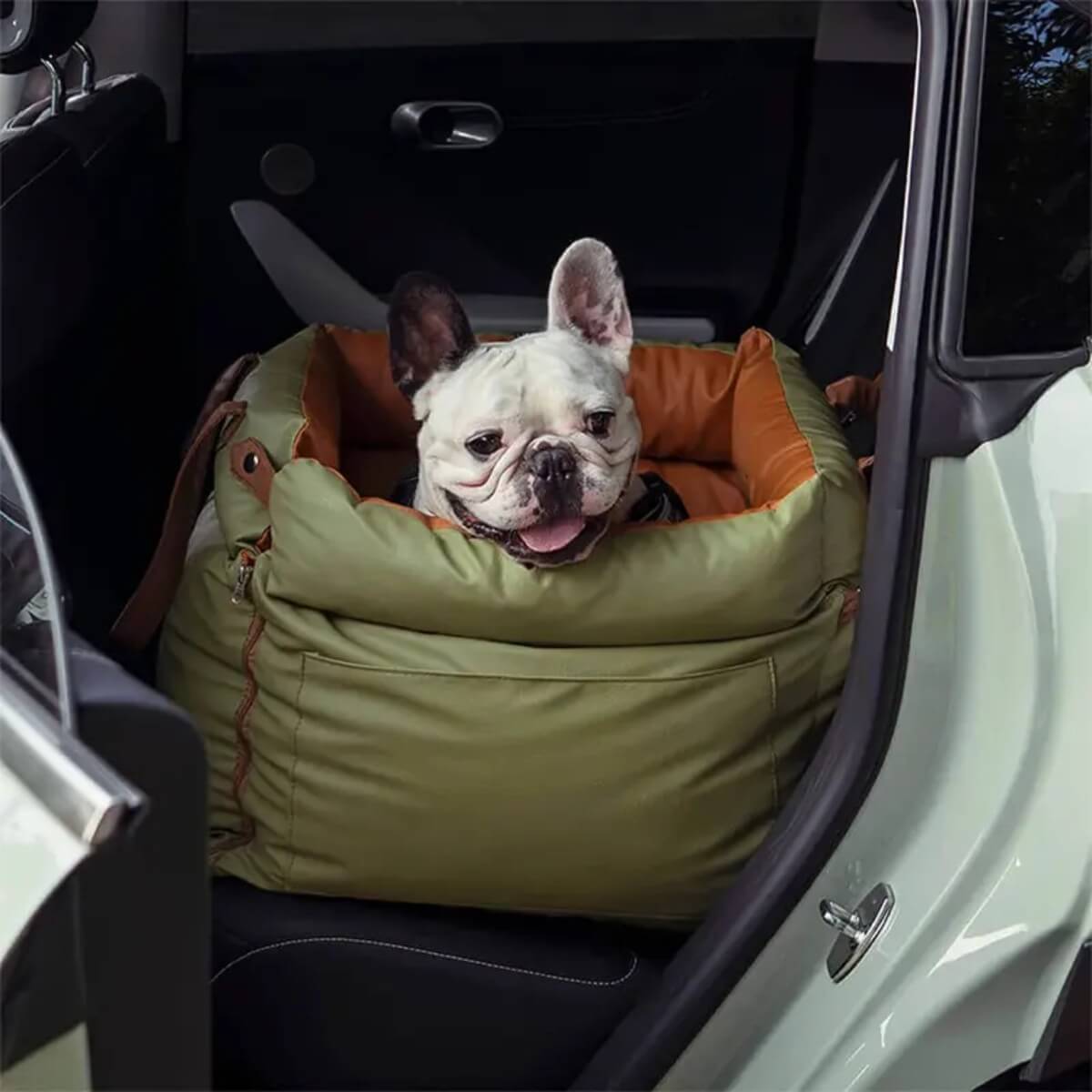 Dog settled in a KovePaws CalmRide calming dog car bed on the back seat